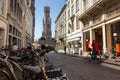 Street scene with bikes in central Bruges, with 13th century Belfry tower. Royalty Free Stock Photo