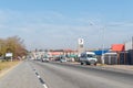 Street scene, with businesses, people and vehicles, in Parys