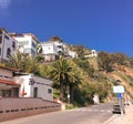 Street scene on Catalina Island with residences overlooking public showers building