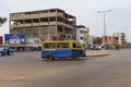 Street scene in the city of Bissau with a bus toca-toca in a roundabout near the Bandim Market, in Guinea-Bissau,