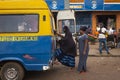 Street scene in the city of Bissau with women boarding a public bus Toca Toca at the Bandim Market, in Guinea-Bissau