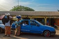 Street scene in the city of Conakry with people vendors selling their goods