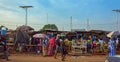 Street scene in the city of Conakry with people vendors selling their goods