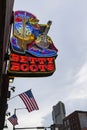 Street scene in the city of Nashville with a neon sign and american flags Royalty Free Stock Photo