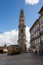 Street scene in the city of Porto with an old tram in front of the Clerigos Tower, in Portugal