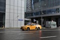 Street scene of city traffic with yellow Yandex taxi car. Public transport in Moscow