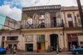 Street scene with classic old cars and traditional colorful buildings in downtown Havana. Cuba Royalty Free Stock Photo