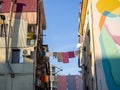 Street scene. Clothes are dried on a line. Colorful houses. Urban environment Royalty Free Stock Photo