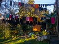 Clothes are dried on a line. Colorful houses. Urban environment. Beautiful sunny day in the city. Yard in Batumi. Aesthetics of