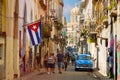 Street scene with cuban flag and classic car in Old Havana Royalty Free Stock Photo