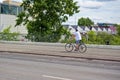 Street scene with cyclist in Berlin. The cycle path was painted to give cyclists more space in traffic