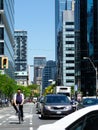 Streetscape in downtown Toronto with tall glass office towers