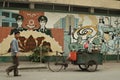 Street scene in the Hanoi,man and the wall with ideological graffity Royalty Free Stock Photo