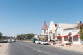 Street scene with historic buildings, businesses and vehicles in