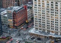 Street scene from Midtown Manhattan, NY seen from overhead showing cars, people and buildings