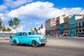 Street scene with old american car in downtown Havana Royalty Free Stock Photo