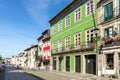 street scene in the old town of Braga with historic facades and people in early morning