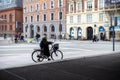 Street scene with pedestrians and bicyclists going about their daily routines in Copenhagen, Denmark