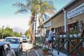 Street scene, people talk to eachother in front of a shop. In the remote town Barrydale, South Africa.