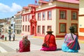 Street Scene of Plaza de Armas Square with the Gorgeous Justice Palace and Group of Local Ladies in Traditional Andean Clothing,