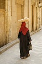 Street scene with veiled woman in cairo old town egypt