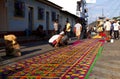 Street screen of locals producing alfombra, sawdust carpets with colorful designs for Semana Santa, Easter on the streets of Lake