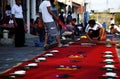 Street screen of locals producing alfombra, sawdust carpets with colorful designs for Semana Santa, Easter on the streets of Lake