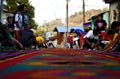 Street screen of locals producing alfombra, sawdust carpets with colorful designs for Semana Santa, Easter on the streets of Lake