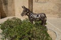 Street sculpture of donkey in Moguer