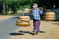 Street seller ,carrying basket in bamboo-rattan