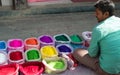 Street seller selling colourful rangoli powder in Kathmandu, Nepal ready for Diwali festival of light. Royalty Free Stock Photo