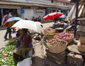 Street sellers at Market in Mombasa, Kenya sat under umbrellas for shade