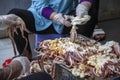 Street sellers seafood, women process squid