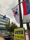 Street of seoul with flags and hangul letters on posters