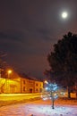 Street with shining tree and street lamp. Royalty Free Stock Photo