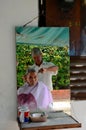 Street side barber cuts hair: Singapore