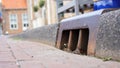 Street on side of road. Curb with interruption of water discharge to the sewer as a well.