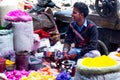 Street side vendor surrounded with gulaal colors for holi