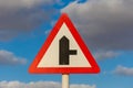 Street sign with blue sky and clouds in background. Royalty Free Stock Photo