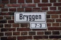 Street Sign for Bryggen, the famous wooden shopping area of Bergen. Bergen, Norway, September 13, 2015. Royalty Free Stock Photo