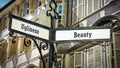 Street Sign Beauty versus Ugliness Royalty Free Stock Photo