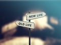 Street sign the direction way to NEW LIFE versus OLD LIFE Royalty Free Stock Photo