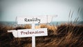 Street Sign to Reality versus Pretension Royalty Free Stock Photo