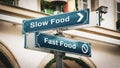 Street Sign Slow versus Fast Food Royalty Free Stock Photo