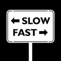 Street Sign the Direction Way to Slow versus Fast isolated on black background Royalty Free Stock Photo