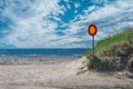 Street sign on a empty road with sea and sky in background. no entry. wrong way Royalty Free Stock Photo