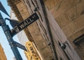 Street sign of famous Wall Street with skylines in background.- New York, USA Royalty Free Stock Photo