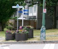 Street sign with flower planters