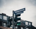 Street sign on a green traffic light in Hamburg, German.