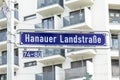 street sign Hanauer Landstrasse engl: road to Hanau - - at blue enamel in Frankfurt Royalty Free Stock Photo